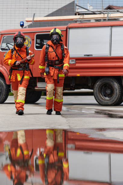 istock A team of confident and accomplished firefighters strides purposefully in their uniforms, exuding pride and satisfaction after successfully completing a challenging firefighting mission 2156342513