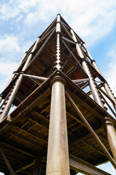 Old water towers. Rusty metal engineering structures. Isolate on a white background.