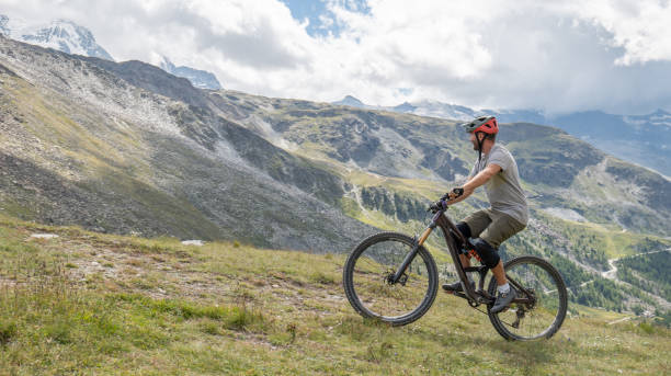 istock Mountain Biker Traversing Alpine Landscape 2156346388