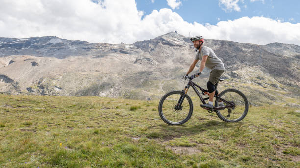 istock Mountain Biker Enjoying Ride in Alpine Meadow 2156346390