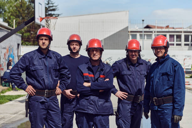 istock A team of confident and accomplished firefighters strides purposefully in their uniforms, exuding pride and satisfaction after successfully completing a challenging firefighting mission 2156347839
