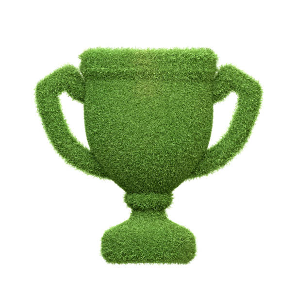 istock A trophy icon covered in lush green grass isolated on a white background, representing achievements in sustainability and environmental excellence 2156348026
