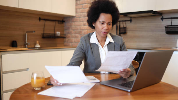 istock Woman calculating her monthly costs 2156349932