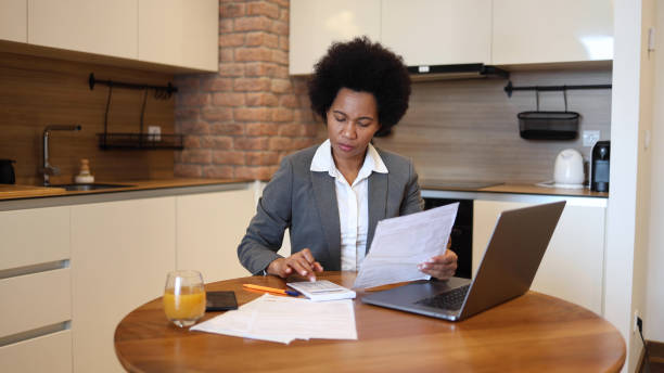 istock Woman calculating her monthly costs 2156350000
