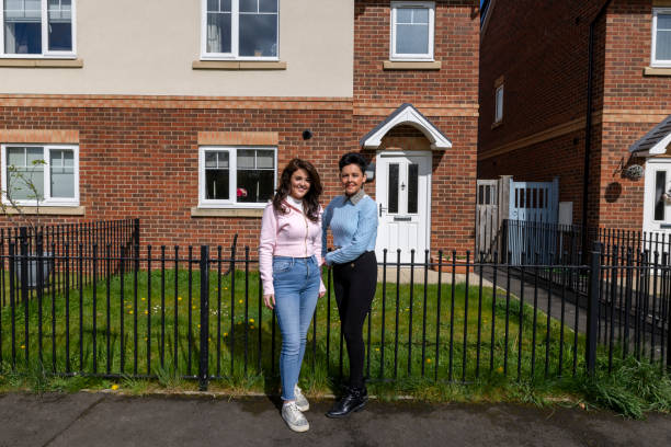 istock Standing Outside of their Home 2156350125