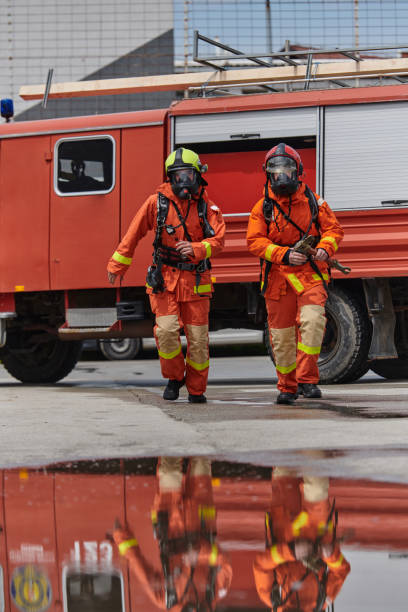 istock A team of confident and accomplished firefighters strides purposefully in their uniforms, exuding pride and satisfaction after successfully completing a challenging firefighting mission 2156350358