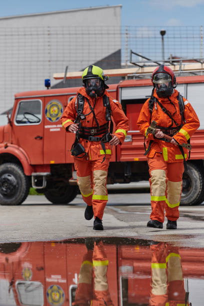 istock A team of confident and accomplished firefighters strides purposefully in their uniforms, exuding pride and satisfaction after successfully completing a challenging firefighting mission 2156350961