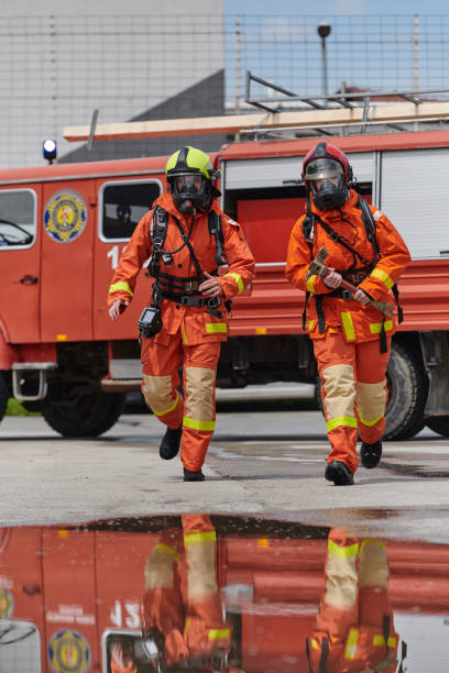 istock A team of confident and accomplished firefighters strides purposefully in their uniforms, exuding pride and satisfaction after successfully completing a challenging firefighting mission 2156351146