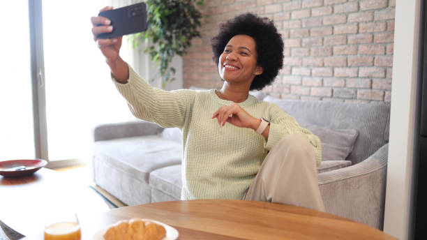 istock African woman taking a selfie 2156351335