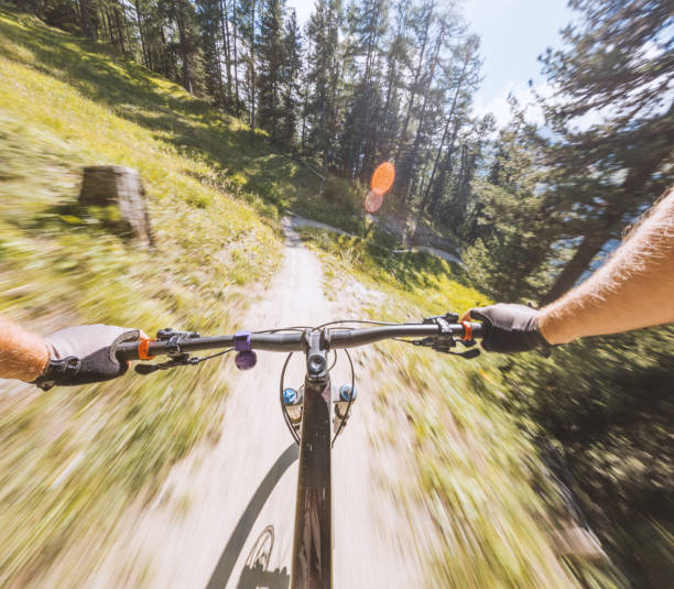 istock Speeding Downhill on a Mountain Bike in the Forest 2156351764