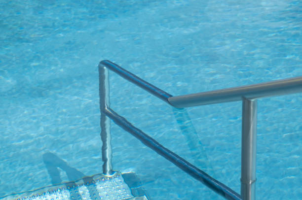istock Staircase area in a public swimming pool. Stainless steel pool and railings. 2156353473