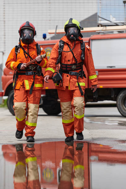 istock A team of confident and accomplished firefighters strides purposefully in their uniforms, exuding pride and satisfaction after successfully completing a challenging firefighting mission 2156353569