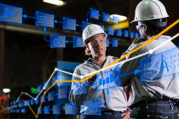 istock Two multiracial women engineers in warehouse conversing 2156353853