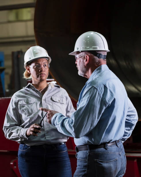 istock Multiracial woman, senior man working in warehouse 2156353860