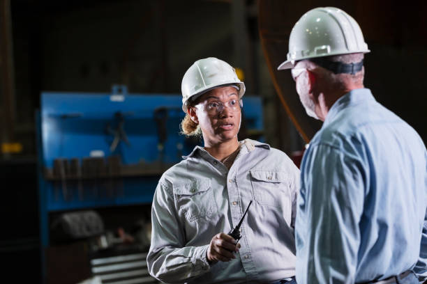 istock Multiracial woman, senior man working in warehouse 2156353868