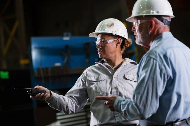 istock Multiracial woman, senior man working in warehouse 2156353871