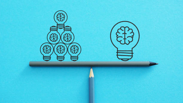 One big idea versus many small ideas with light bulbs. Idea light bulbs on a scales.