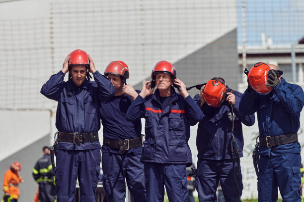 istock A team of confident and accomplished firefighters strides purposefully in their uniforms, exuding pride and satisfaction after successfully completing a challenging firefighting mission 2156354878