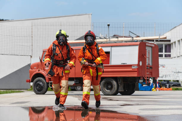 istock A team of confident and accomplished firefighters strides purposefully in their uniforms, exuding pride and satisfaction after successfully completing a challenging firefighting mission 2156355641