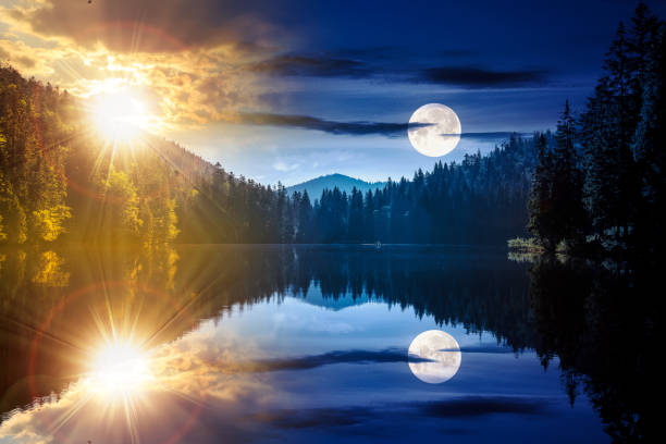 istock fantasy scenery with mountain lake among forest at summer solstice 2156356133