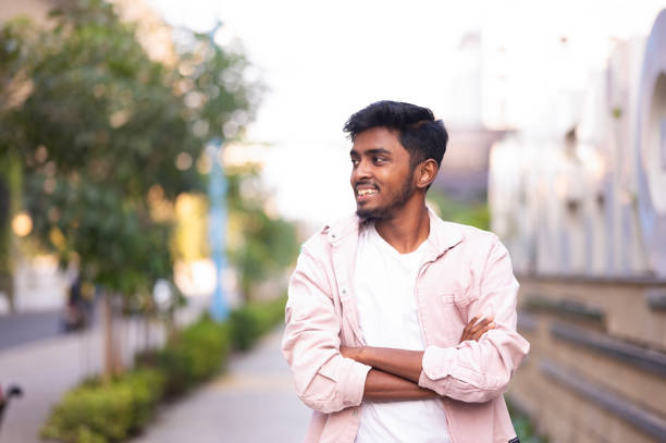 istock Smiling Young Man with Crossed Arms 2156357586