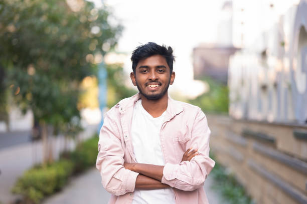 istock Smiling Young Man with Crossed Arms 2156357588
