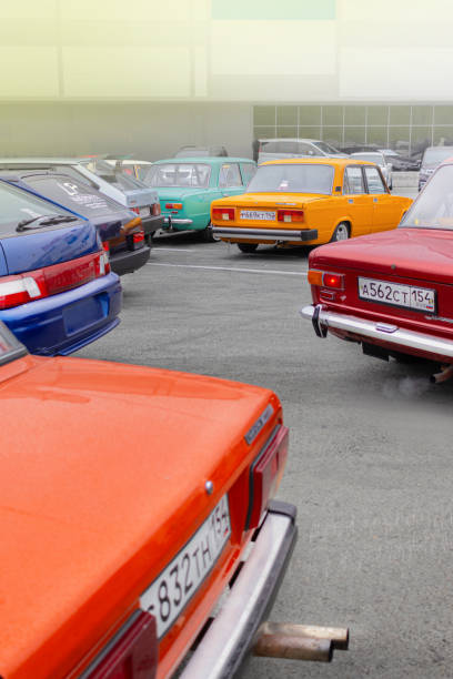 Russia, Novosibirsk, 25.05.2024 Midday, Old Soviet colorful cars at the exhibition, LADA Classic, Zhiguli vertical photo