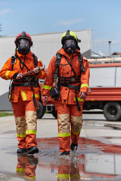 istock A team of confident and accomplished firefighters strides purposefully in their uniforms, exuding pride and satisfaction after successfully completing a challenging firefighting mission 2156362568