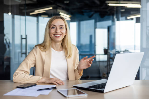 istock Professional woman smiling during a video conference call 2156362583
