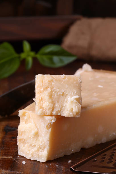 istock hard parmesan cheese on a wooden board 2156364905
