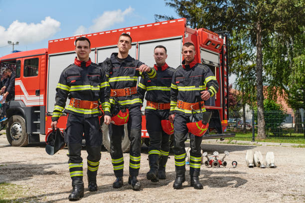 istock Team of Professional Firefighters Ready in Full Gear for Dangerous Situations 2156366377