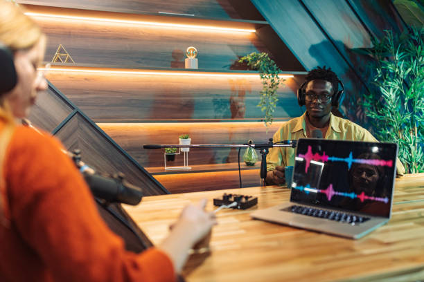 istock Man and woman talking on podcast 2156368043