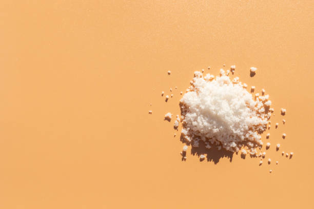 istock Top View Mockup Kosher Mineral Unrefined Sea Salt, Natural Grain Crystals, Copy Space for Text. Beach Yellow Background. Baja Salt. Horizontal Plane, Template 2156368875