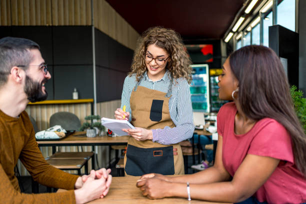 istock Waitress receiving orders at a fast food restaurant 2156368893