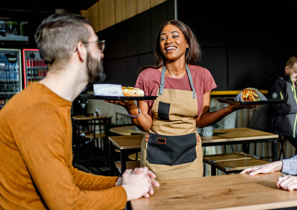istock Waitress serving food at a fast food restaurant 2156368916