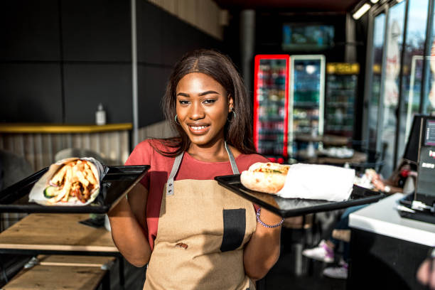istock Waitress serving food at a fast food restaurant 2156369002