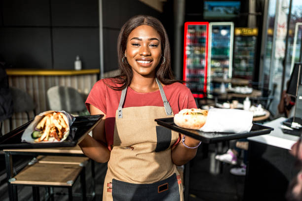 istock Waitress serving food at a fast food restaurant 2156369063