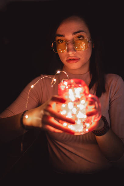 istock Woman in sunglasses with lamp 2156369371