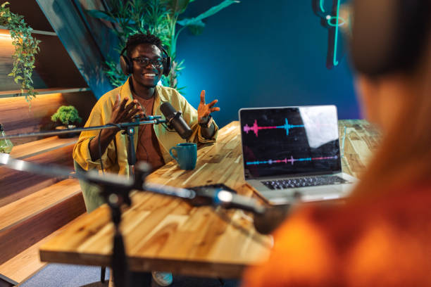 istock Man and woman talking on podcast 2156370244