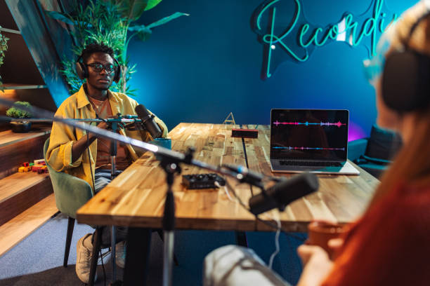 istock Young man and woman talking on podcast 2156371223