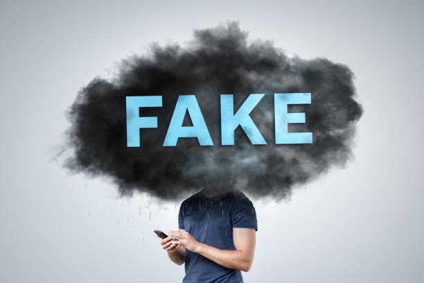 istock A 'Fake' Labeled Dark Cloud Covering a Person's Head 2156371512