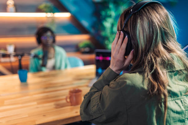 istock Young women talking on podcast 2156371692