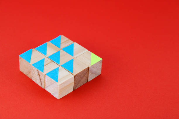 Wooden cubes with one arrow going forward and the rest going back