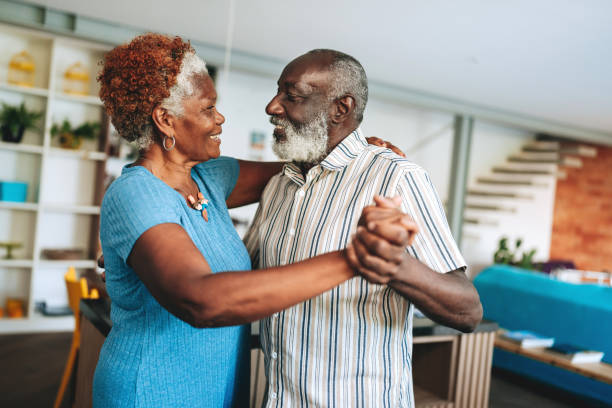 istock Senior couple dancing at home 2156374847
