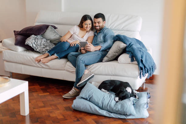 istock Young couple relaxing at home 2156377319