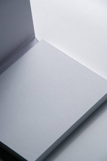 A blank notepad mockup with soft shadows, perfect for showcasing minimalist designs.