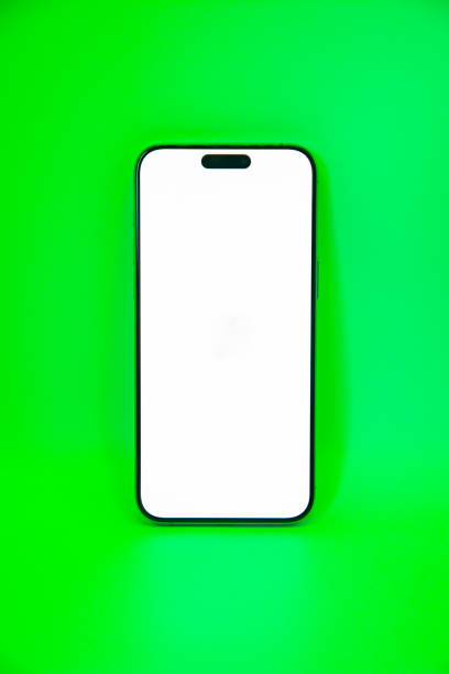 istock Smartphone with a blank screen on a green background. Smartphone mockup closeup isolated on white background. 2156380417