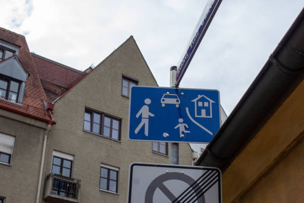 Children at play traffic sing in Germany, set caution kids zone.