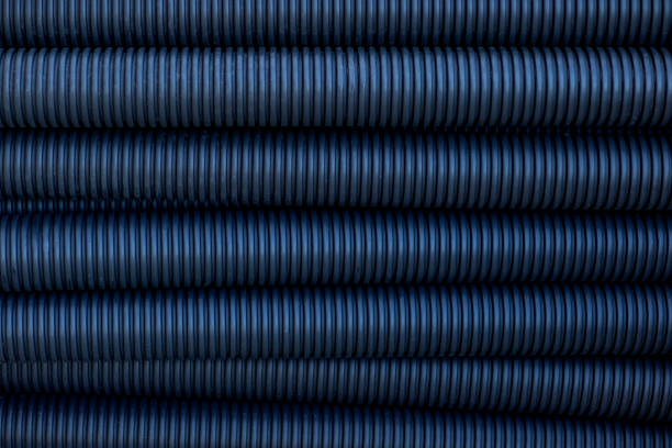 Abstract background of blue corrugated plastic pipes