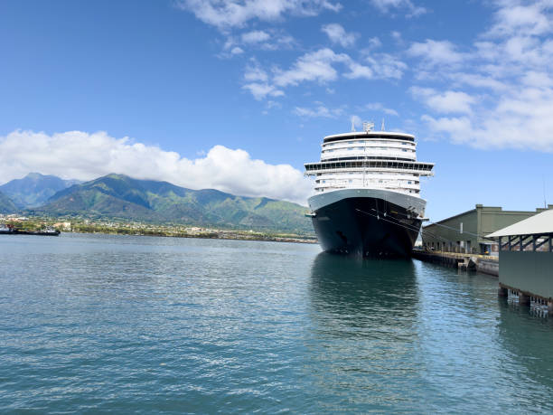Kahului, Maui, Hawaii -- February 8, 2024: Holland America Koningsdam cruises ship is docked at Kahului cruise ship terminal. This port is near the airport, so rental vehicles are easy to obtain. Additionally, rideshare vehicles can be hailed from the shopping mall a short walk away.